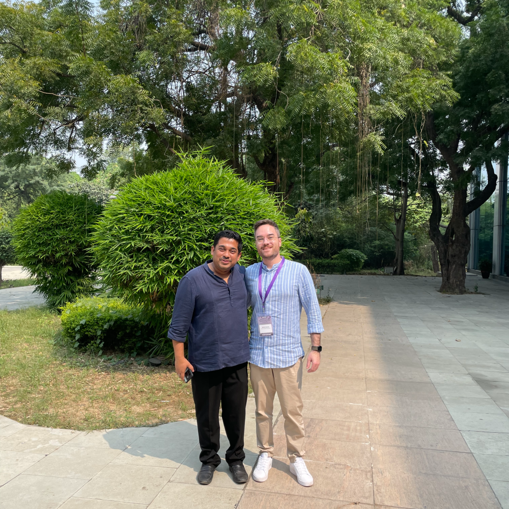 Photo of Dr. Debojyoti Chakraborty and me standing in front of the CSIR‑IGIB (Institute of Genomics and Integrative Biology) building in New Delhi during a workshop visit.